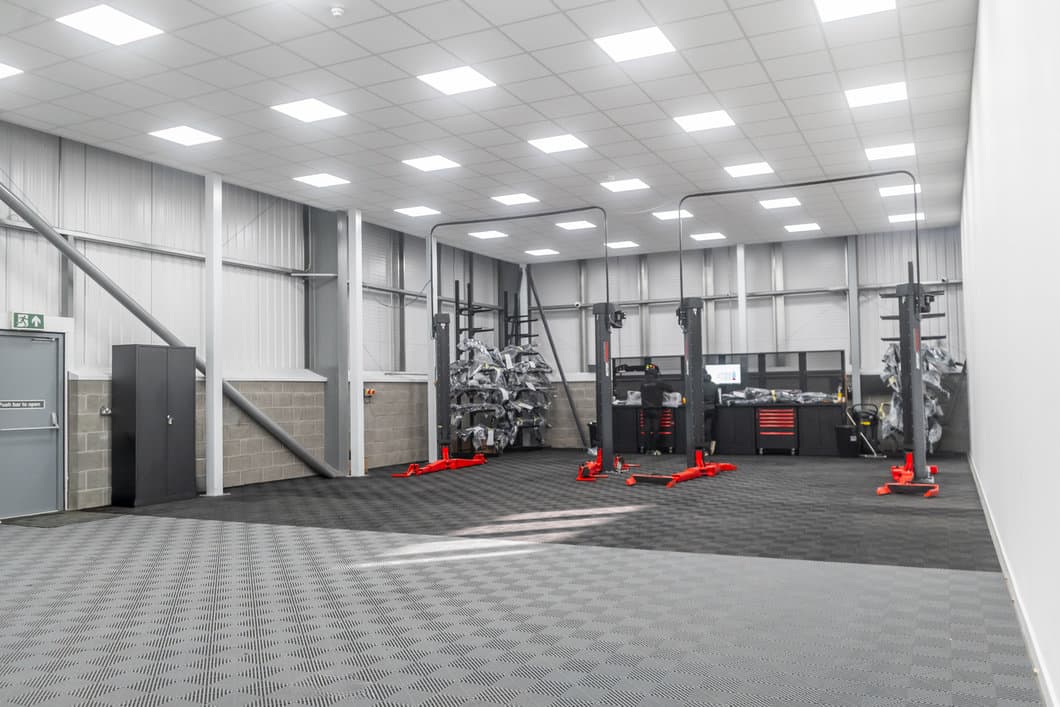 Maxton Design body kit fitting workshop with professional car lifts