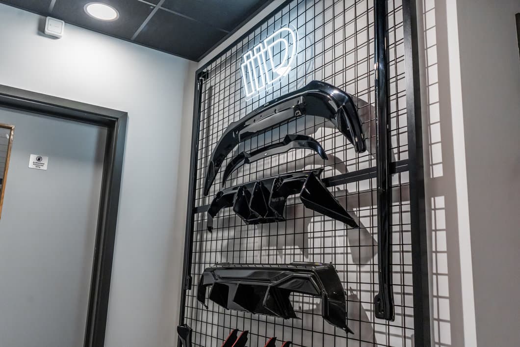 Maxton Design reception product wall displaying rear diffusers and front splitters